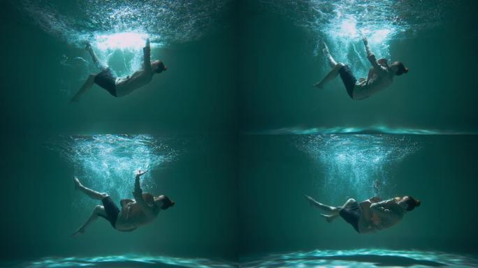 令人惊叹的电影背景，沮丧的女人穿着正式的西装潜水，下沉水下慢动作。精神倦怠。
