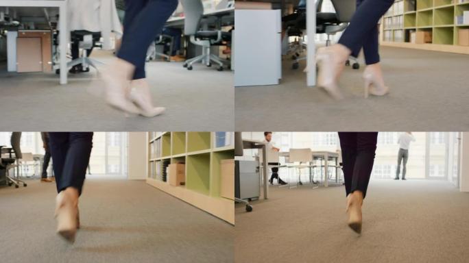 4k视频片段，一个无法识别的女商人走过办公室