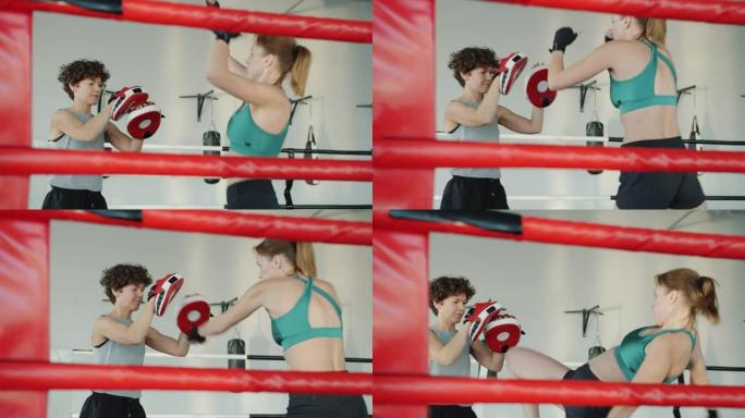 年轻女子跆拳道，女教练在健身房练习踢和拳