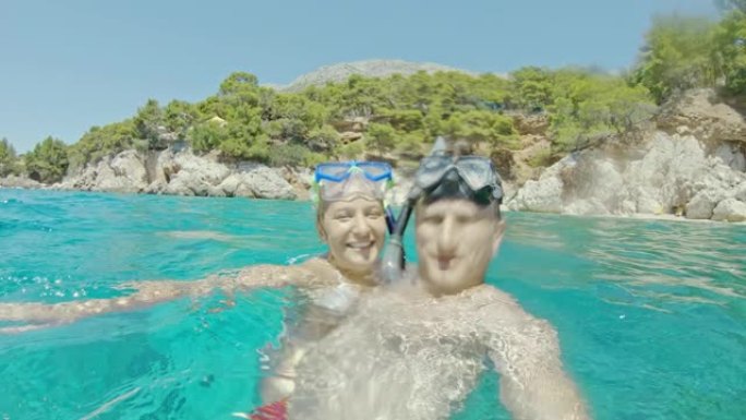 克罗地亚阳光明媚的亚得里亚海，波夫女士带着浮潜护目镜快乐的夫妇