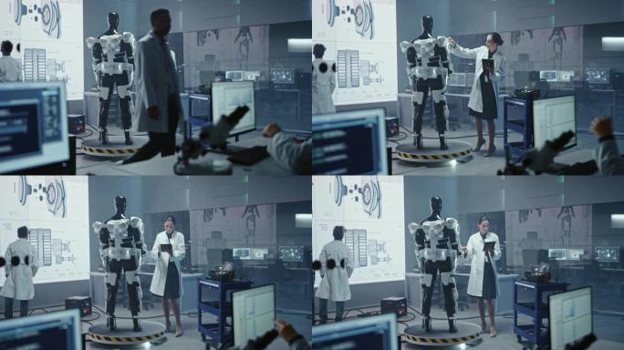 在机器人技术发展实验室: 女科学家使用数字平板电脑，在机器人外骨骼原型上工作。工程师设计Exosui
