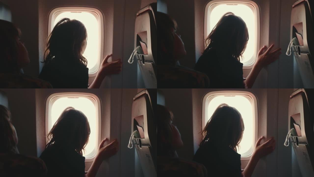 快乐的十几岁的乘客女孩在飞行起飞期间喜欢从飞机窗户座位上看出来的特写镜头。