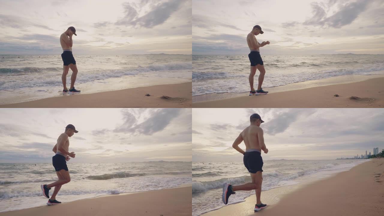 男性在海滩度假跑步。
