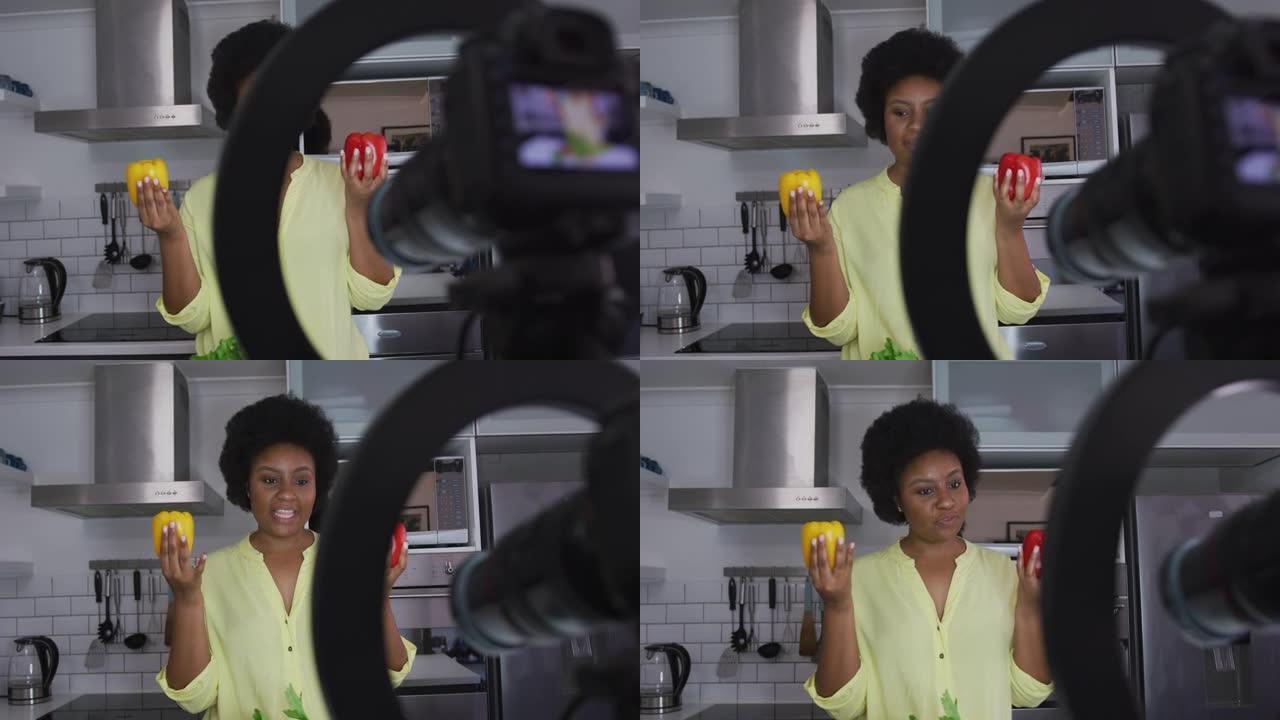 非裔美国女性加大码视频记录器录制了一段关于烹饪的视频
