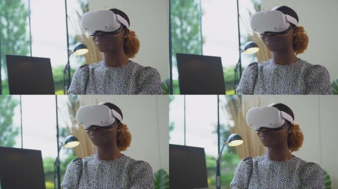 使用AR技术在家庭办公室工作的女性坐在办公桌前戴着VR耳机的特写镜头