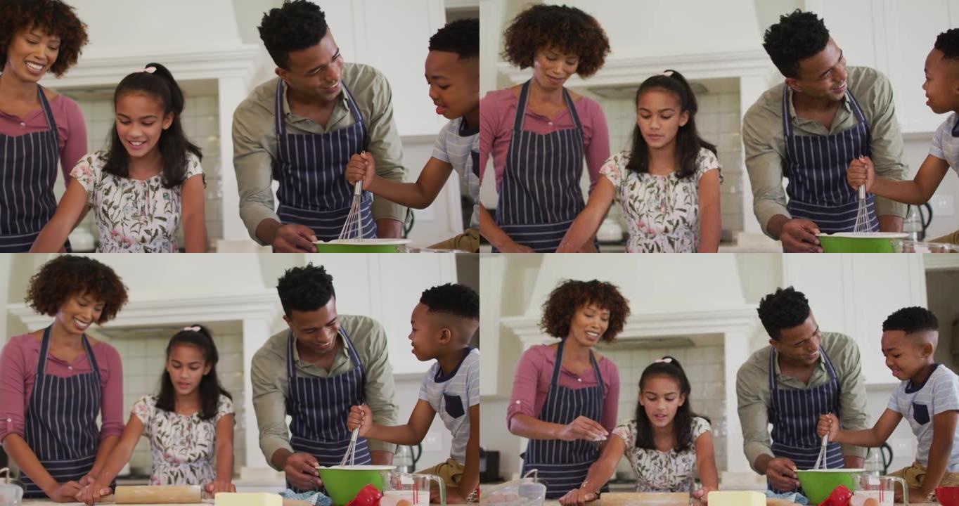 非裔美国人家庭在家里的厨房里一起烘烤