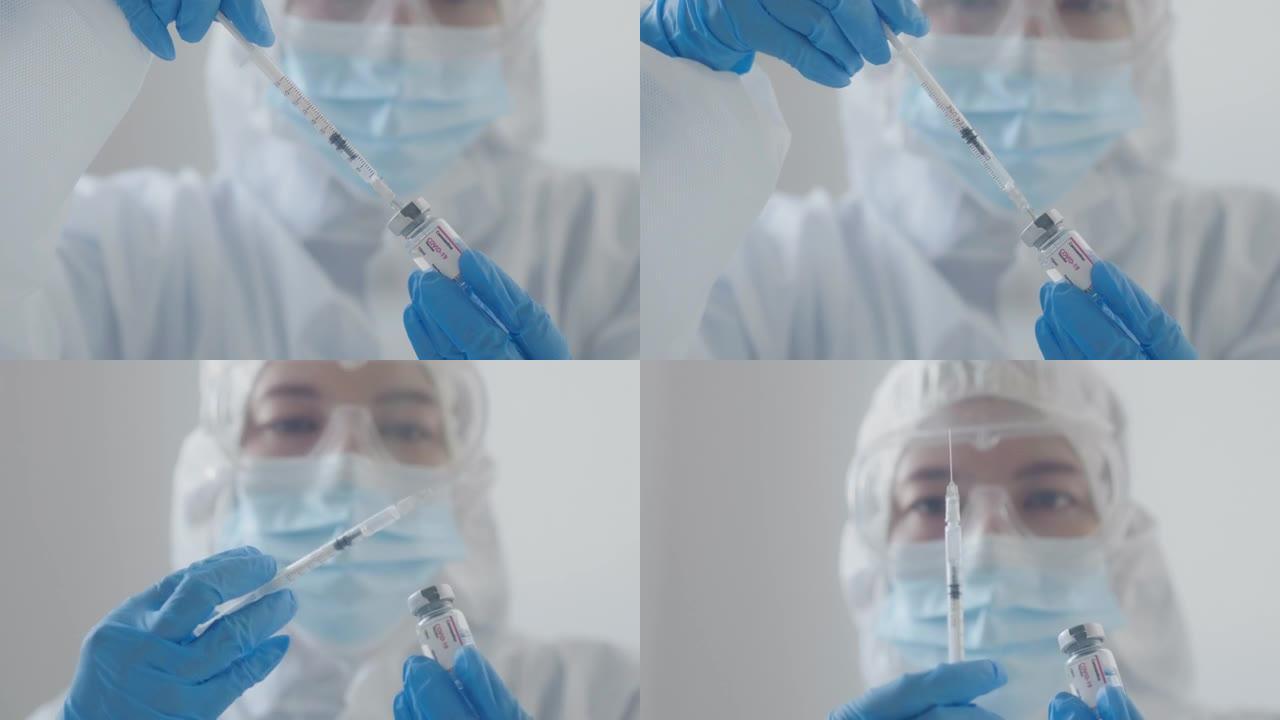 女性在蓝色医用手套中手持新型冠状病毒肺炎疫苗。