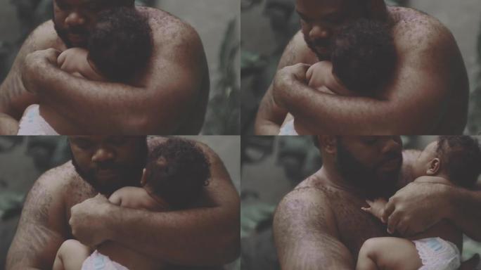 非洲父亲抱着新生儿