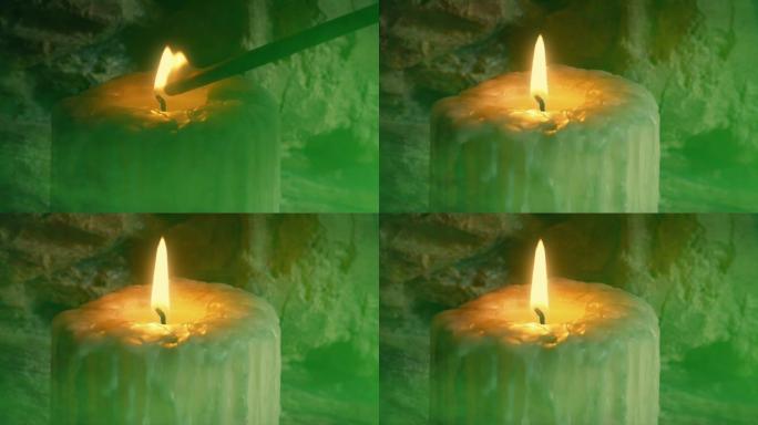 蜡烛在烟熏的绿色洞穴中点燃