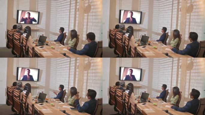 亚洲华人商务会议在会议室与电视屏幕展示