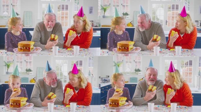 祖父母与孙女一起庆祝生日，一起在家里吃蛋糕