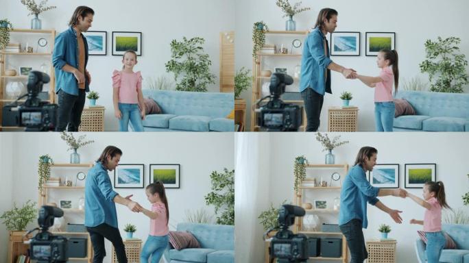 男人和小女孩的慢动作跳舞和聊天录制视频在线vlog在家里