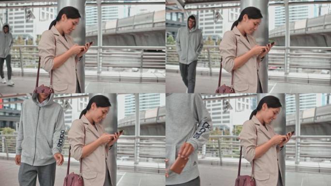 小偷来偷钱包时，女人正在用手机