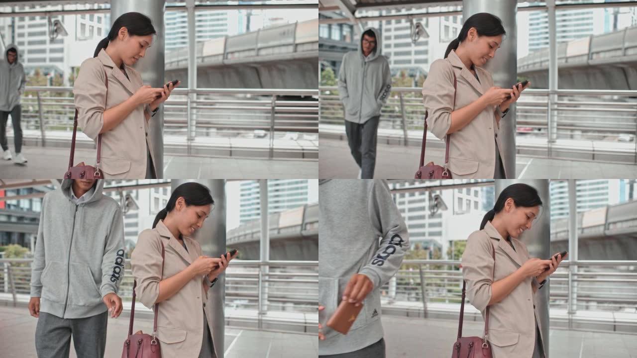 小偷来偷钱包时，女人正在用手机