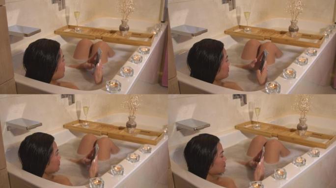 在洗澡时用智能手机拍摄的美丽女士的特写镜头
