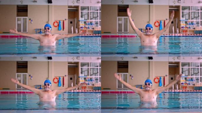 高级男子在室内游泳池中伸展手臂