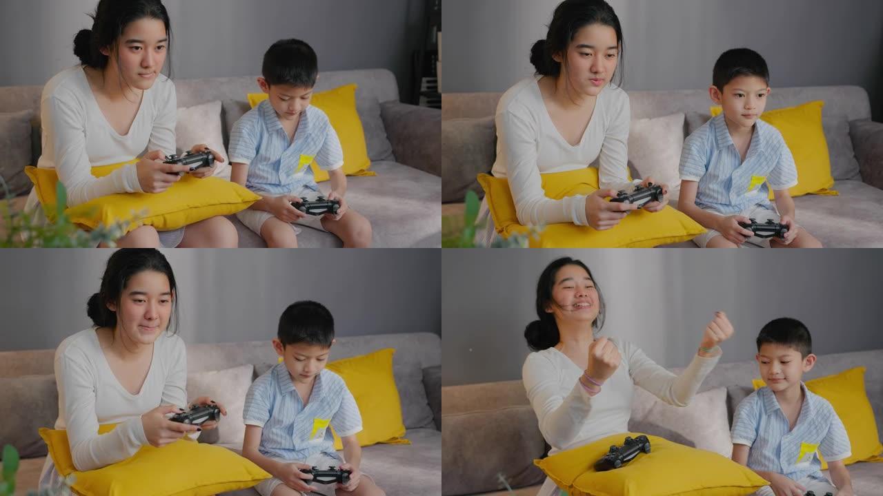 亚洲兄弟少女在与兄弟在家玩游戏机时击败兄弟