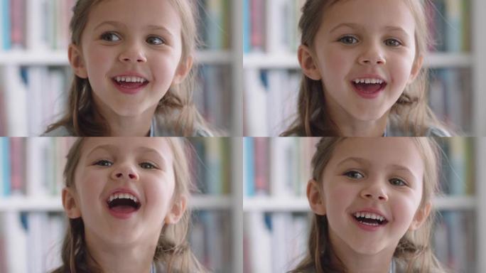 肖像美丽的小女孩带着自然的童年好奇心微笑着看着快乐的孩子带着天真俏皮的表情4k镜头