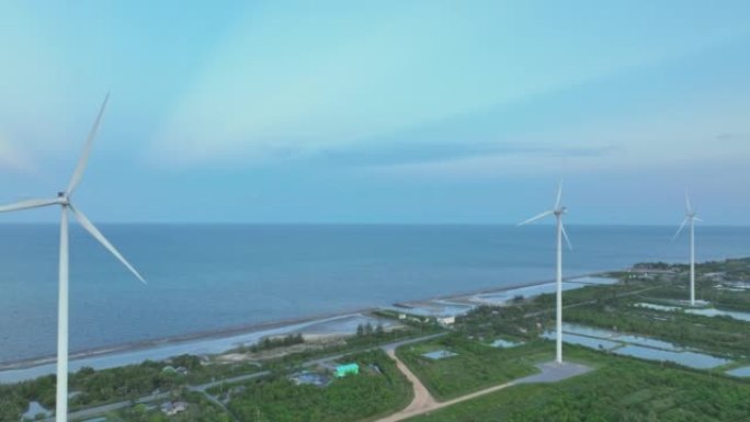 鸟瞰图日落中用于能源生产的风力涡轮机领域。