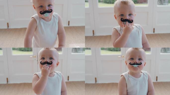 有趣的婴儿戴着小胡子奶嘴快乐的幼儿吮吸假人有趣可爱的婴儿在家享受愚蠢的幽默4k