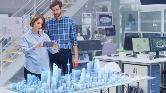 建筑师和工程师进行了讨论，使用增强现实智能手机设计可持续的3D Megalopolis城市模型。未来
