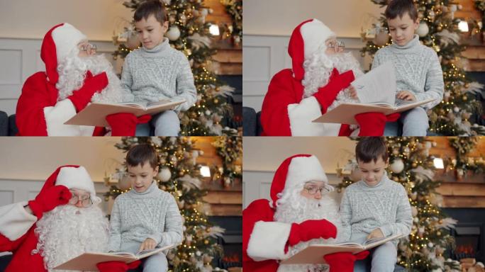 可爱的男孩和圣诞老人在元旦在装饰好的树附近聊天和看书