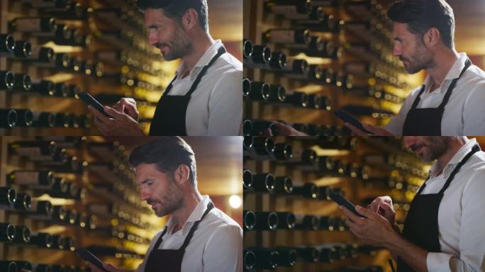 现代农民或酿酒师正在使用智能手机上的酒庄在线商务应用程序来检查客户服务并在酒窖中销售他的葡萄酒生产的