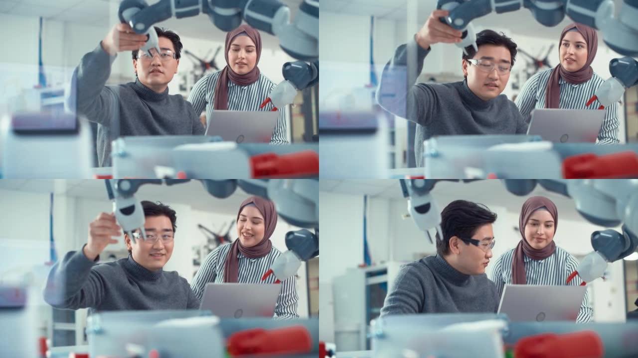 阿拉伯女性未来工程师看如何工作娴熟的开发人员。亚洲人解释和检查机器人手臂。分析和评估原型和机器人系统