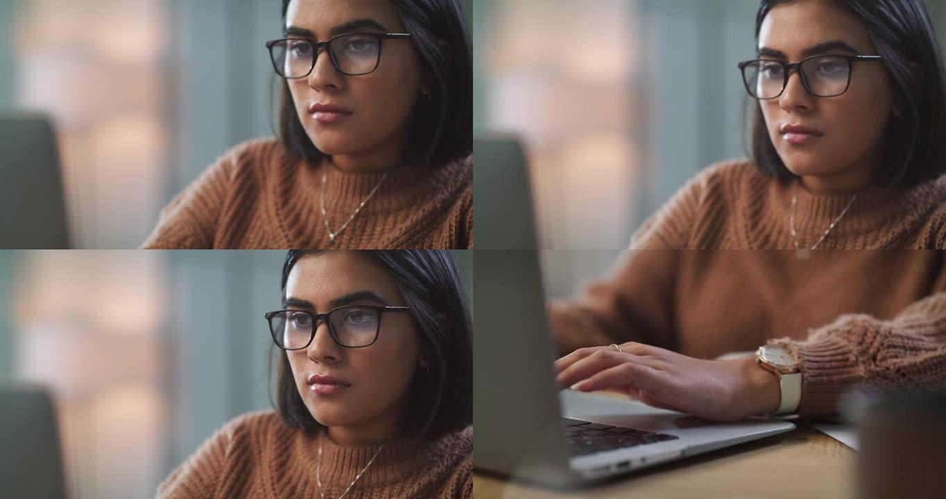 4k视频片段，一个迷人的年轻女子独自坐在家里，用她的笔记本电脑进行电子学习