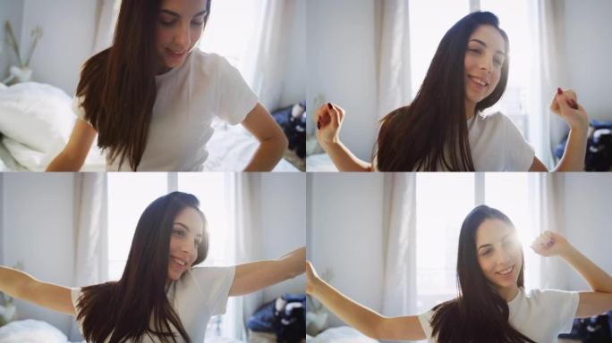 真实的近距离拍摄的一个年轻的黑发女子是醒来的床