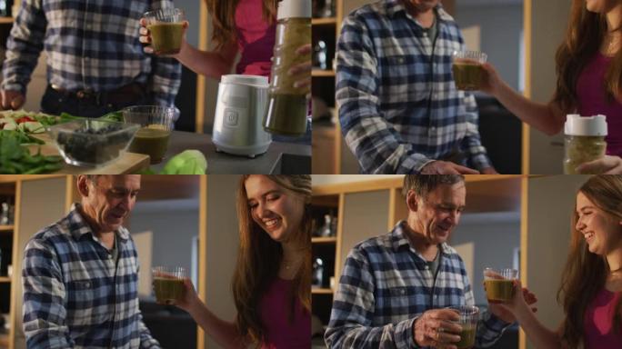 微笑的白人高级父亲和十几岁的女儿在厨房里准备健康饮料