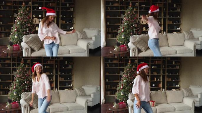 喜出望外的青少年女性戴着圣诞帽，被欢乐的音乐打动