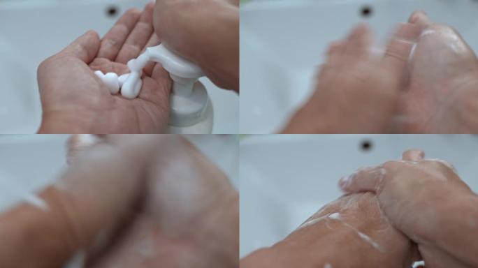 SLO MO洗手液泡沫从瓶子里挤出到男性手上，POV特写