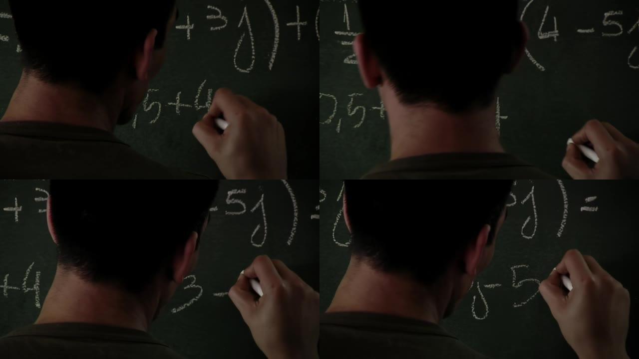 数学老师在黑色黑板上写公式。特写。