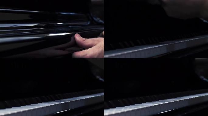 男性手打开钢琴盖或钢琴落板。特写。4k分辨率。