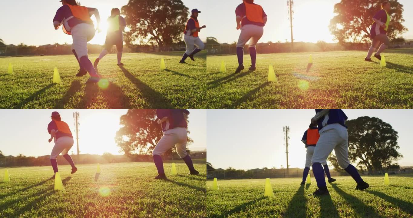 各种各样的女棒球运动员在球场上运动，在锥体之间奔跑