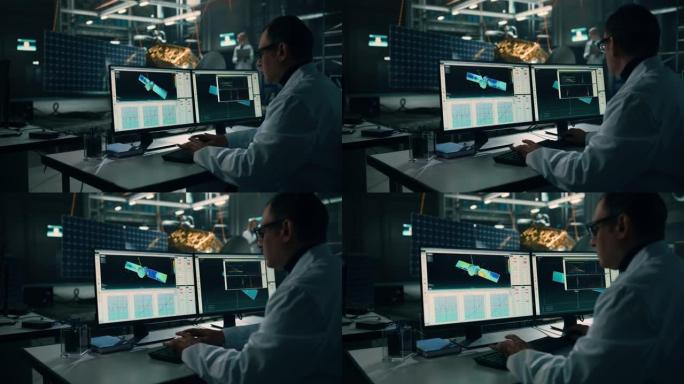 男工程师在进行卫星建设时使用计算机。航空航天局: 由科学家组成的多元化团队，负责监督太空探索任务的航