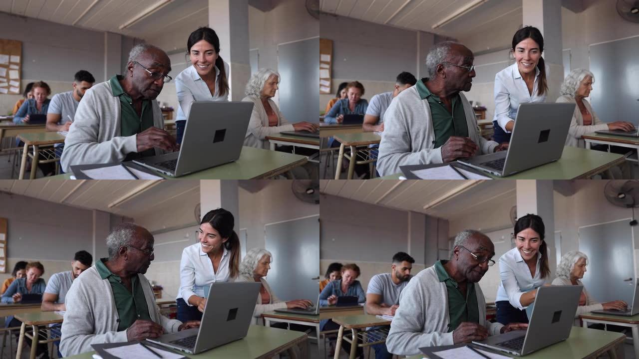 黑人高年级男子在课堂上使用计算机，而老师在屏幕上指出某些内容