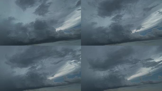 风景优美的暴风雨云在天空中流下。时间流逝
