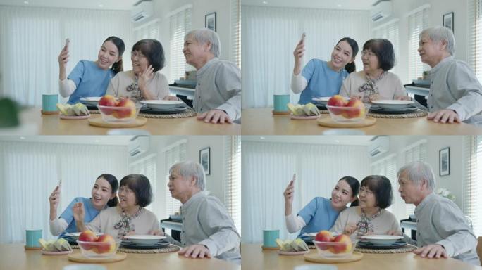 亚洲老年夫妇和护士护理手持手机自拍视频