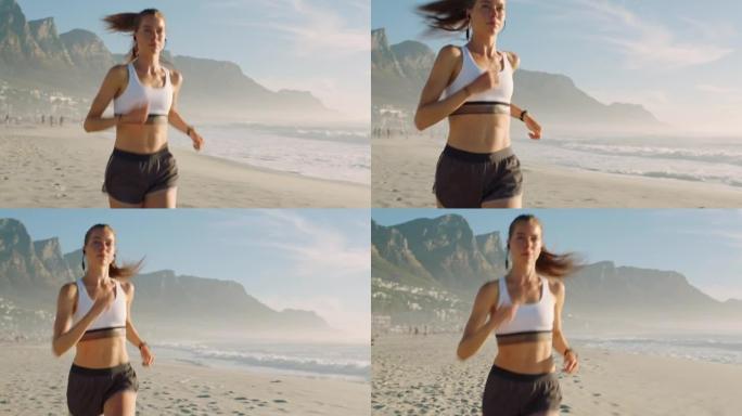 健康，健康和运动的活跃，运动的女性在沙滩上用耳机跑步。适合女性慢跑，一边做有氧运动一边享受新鲜空气，