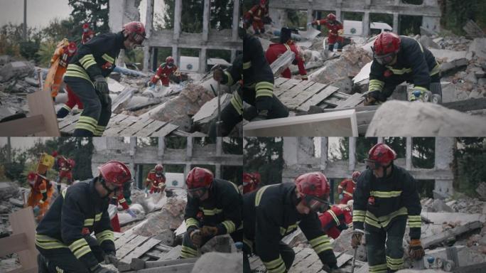 救援队正在拆除的建筑物的残骸上工作