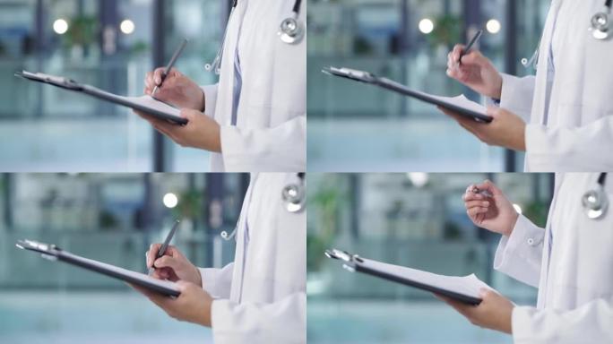 一名医生在现代医院写笔记的4k视频片段