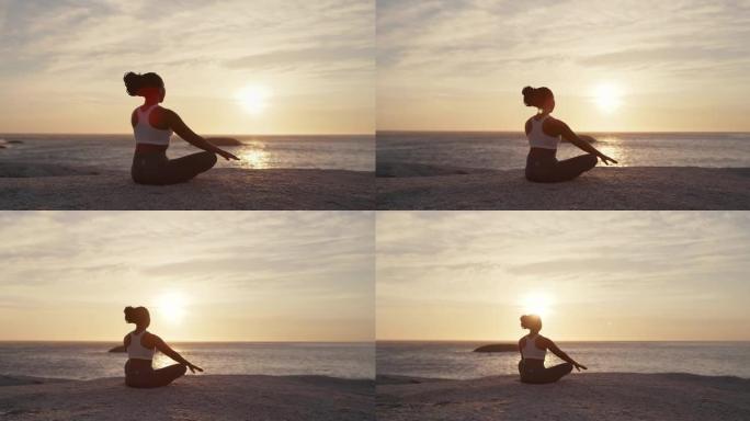 4k视频片段，一名年轻女子在海滩上练习深度冥想