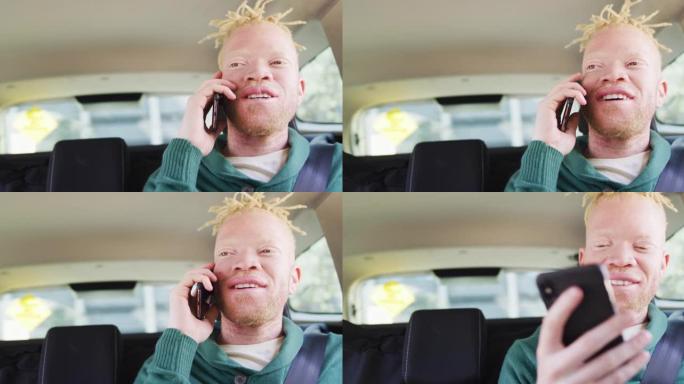 快乐的白化病非裔美国男子，长发lock坐在汽车上，用智能手机聊天