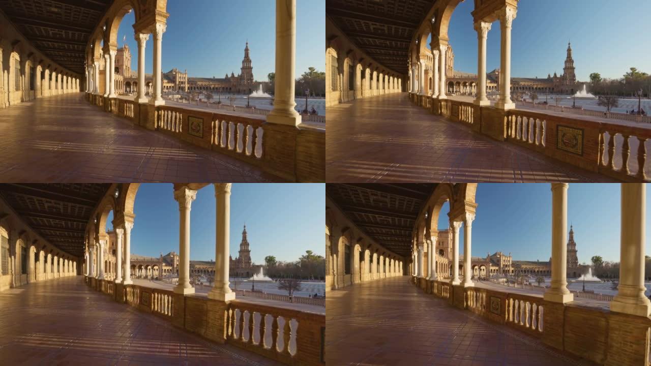穿过西班牙广场建筑群。摄像机沿着西班牙塞维利亚西班牙广场的柱子走廊移动。。万向节高质量镜头，4K