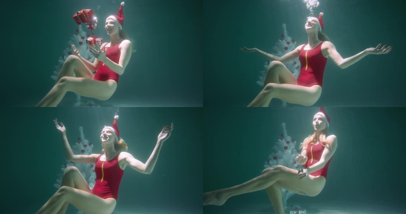 令人惊叹的水下肖像快乐快乐微笑的年轻女子穿着红色泳衣，双手张开礼物慢动作。