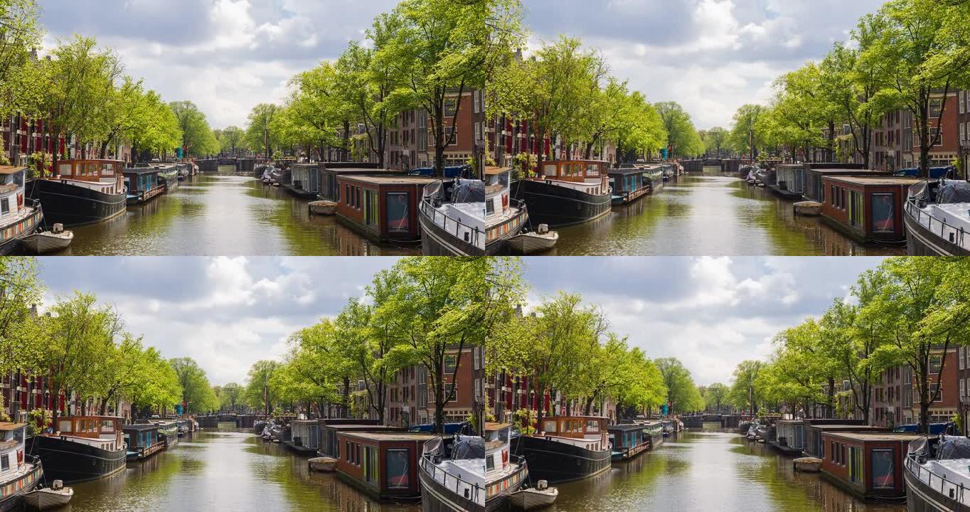 在一个美丽的晴天，用船和船屋俯瞰阿姆斯特丹河运河