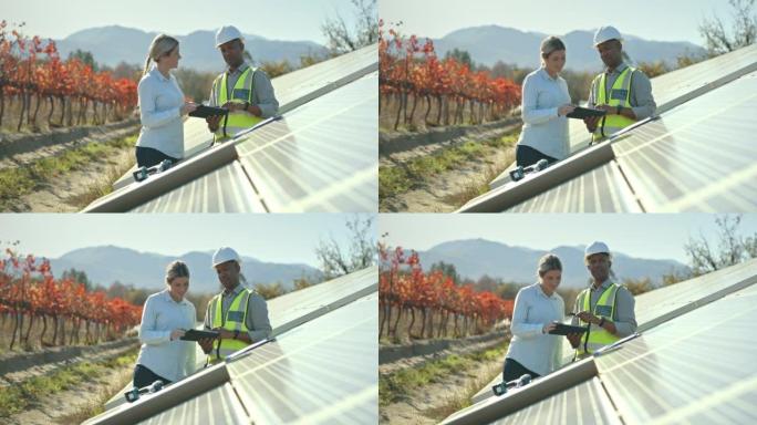太阳能电池板，男女可再生能源，工程师和清洁能源电池板，电力规划和战略。可持续、生态和替代来源以及生态