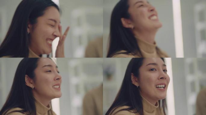 亚洲妇女在讲述自己的抑郁症时哭泣的特写镜头。